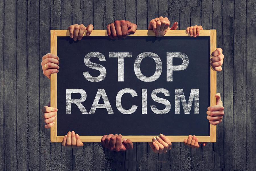 Sign reading "stop racism"